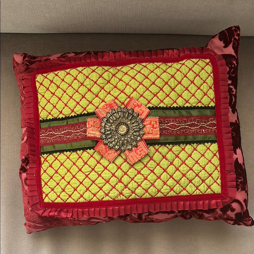 Decorative Red and Yellow Pillow with Floral Accent